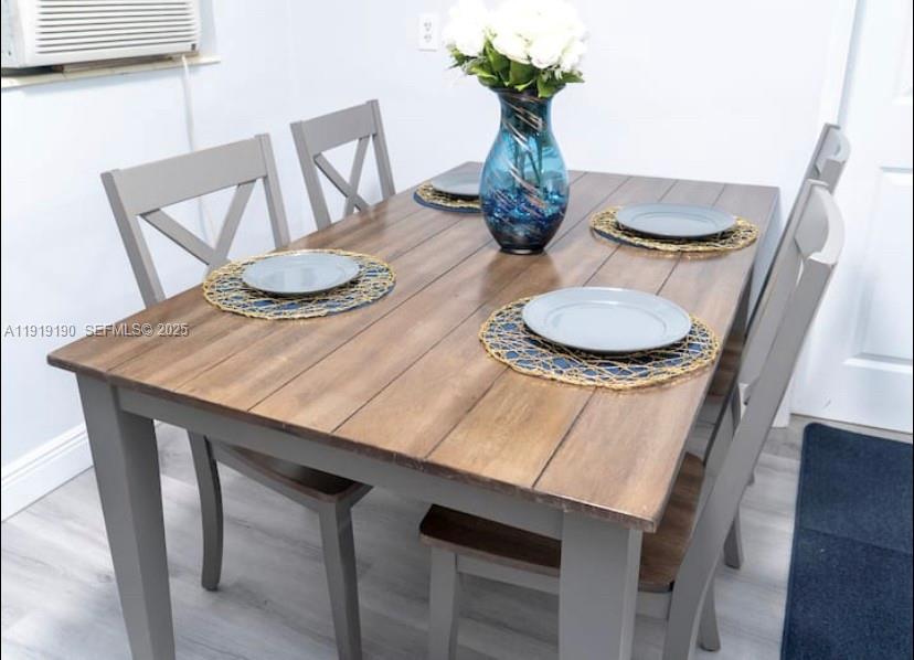 6512 Southwest 24th Street, Unit 1 Miramar, FL 33023 - Photo 4 of 15 a table and chairs in a room