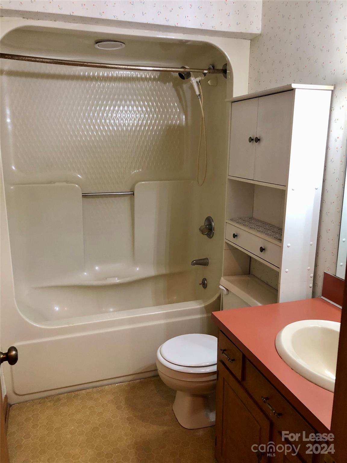 1637 Green Acres Road Lincolnton, NC 28092 - Photo 11 of 12 a bathroom with a toilet a sink and bathtub