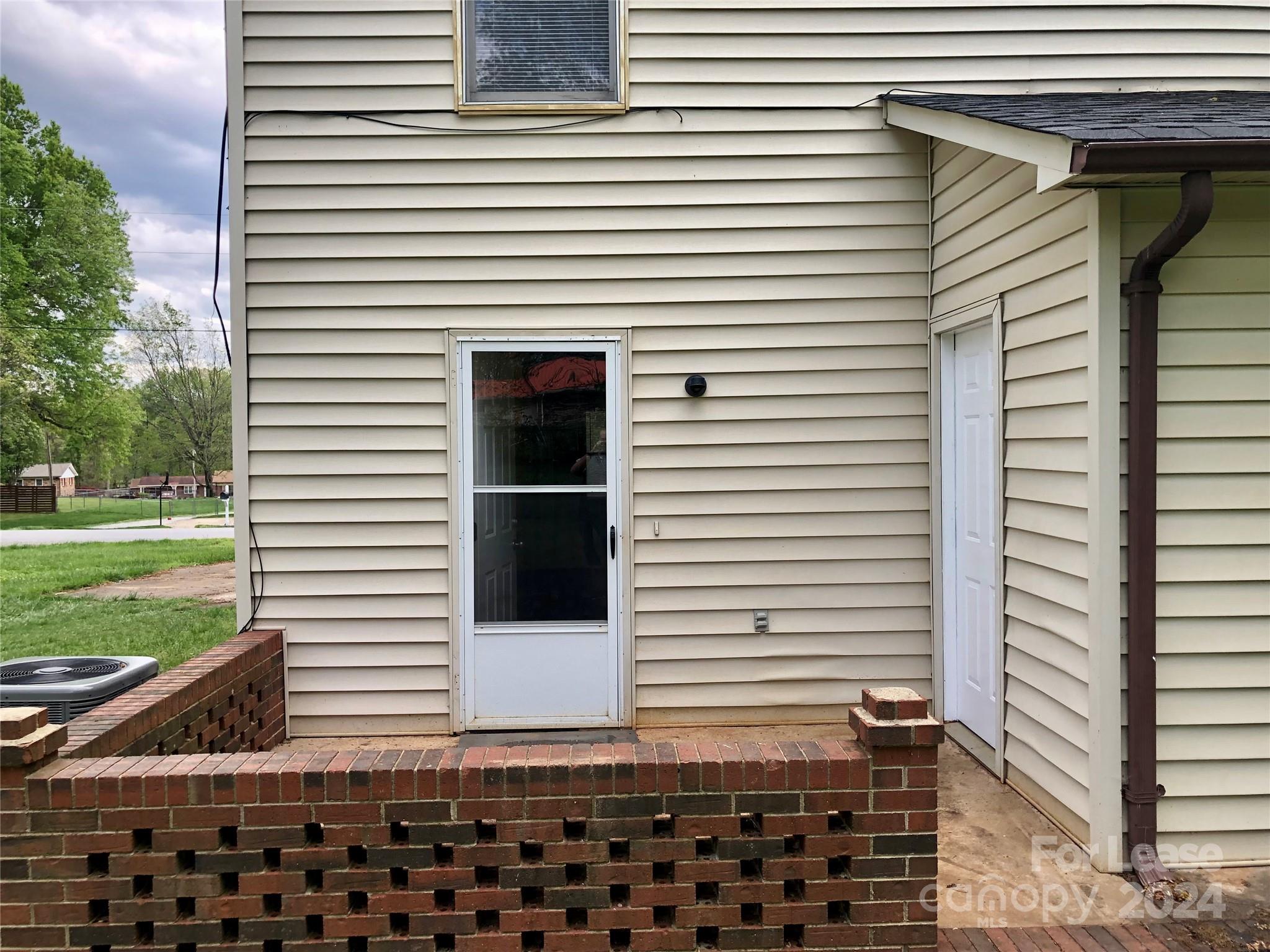 1637 Green Acres Road Lincolnton, NC 28092 - Photo 2 of 12 a view of a house with a door and a yard