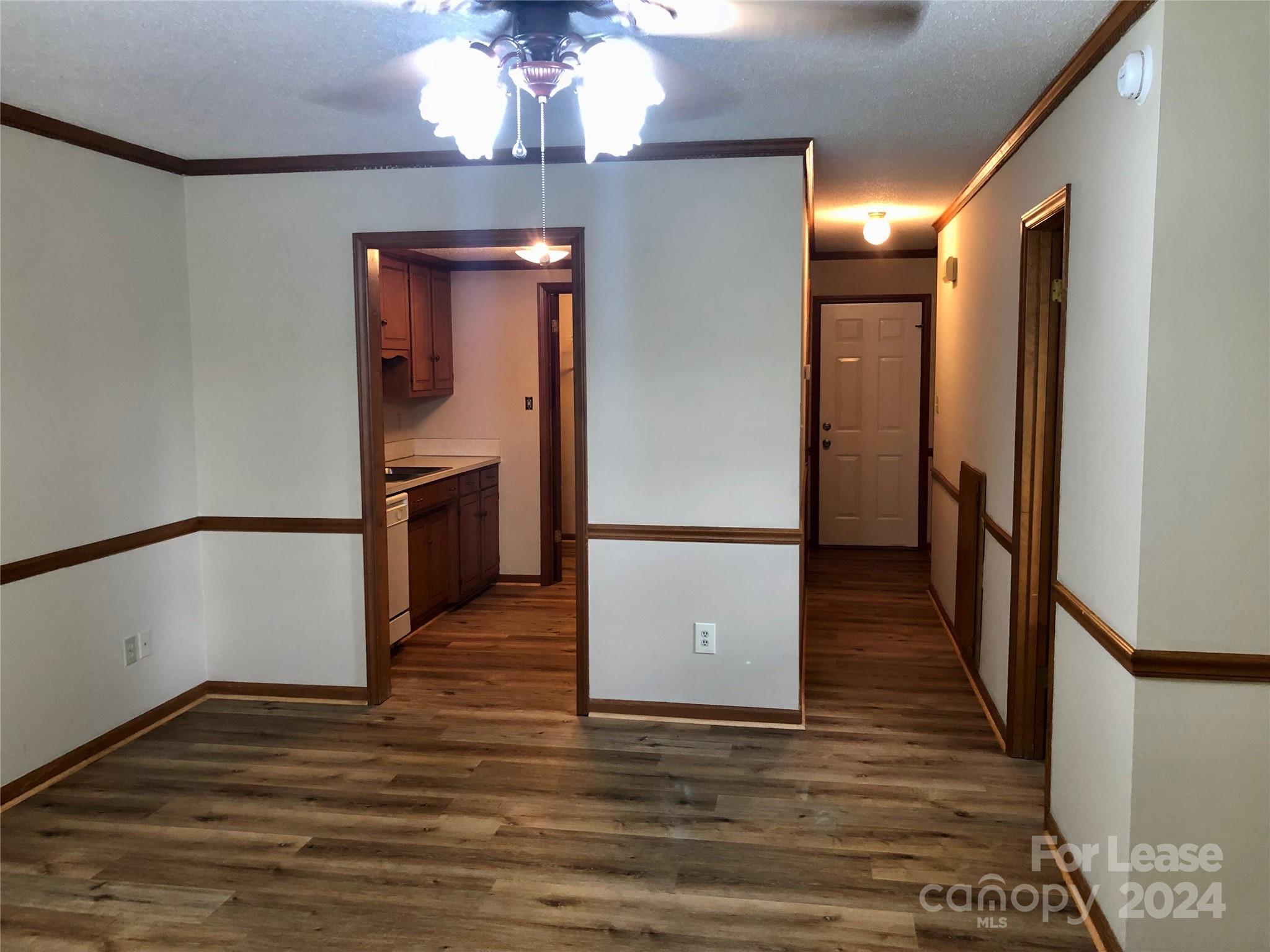 1637 Green Acres Road Lincolnton, NC 28092 - Photo 3 of 12 a view of a hallway with wooden floor and staircase