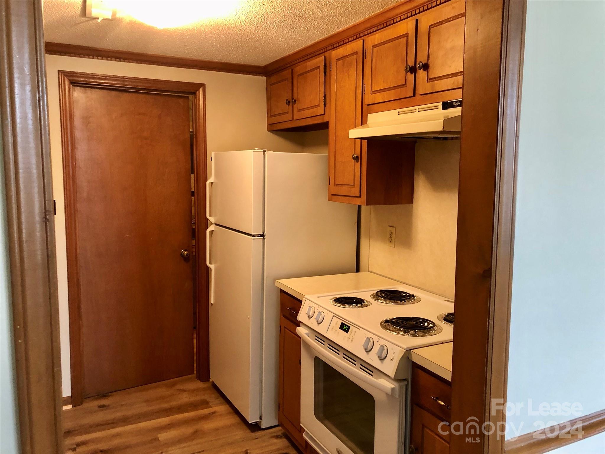 1637 Green Acres Road Lincolnton, NC 28092 - Photo 6 of 12 a kitchen with a stove and a refrigerator