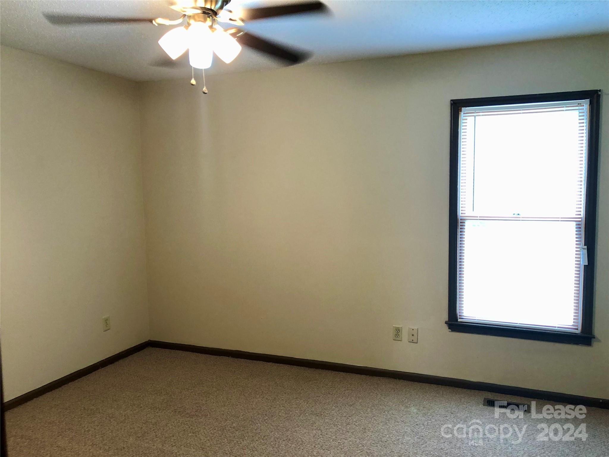 1637 Green Acres Road Lincolnton, NC 28092 - Photo 9 of 12 an empty room with a window