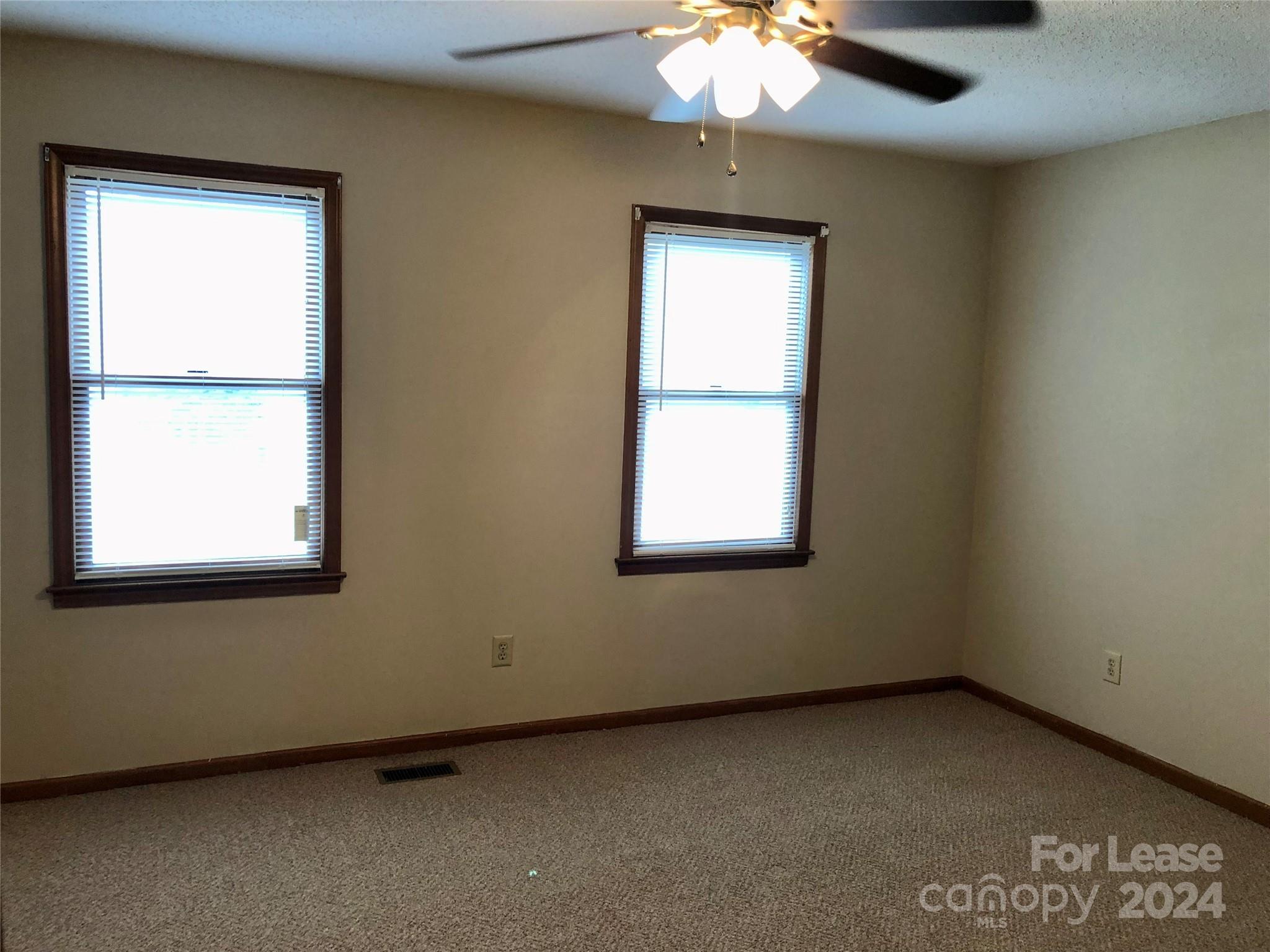 1637 Green Acres Road Lincolnton, NC 28092 - Photo 10 of 12 an empty room with a window