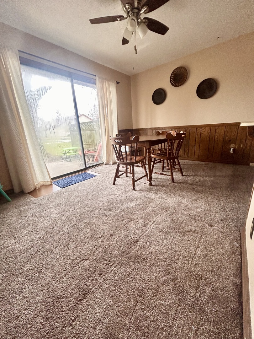 412 Spring Circle Urbana, IL 61802 - Photo 7 of 21 a view of an empty room with a window