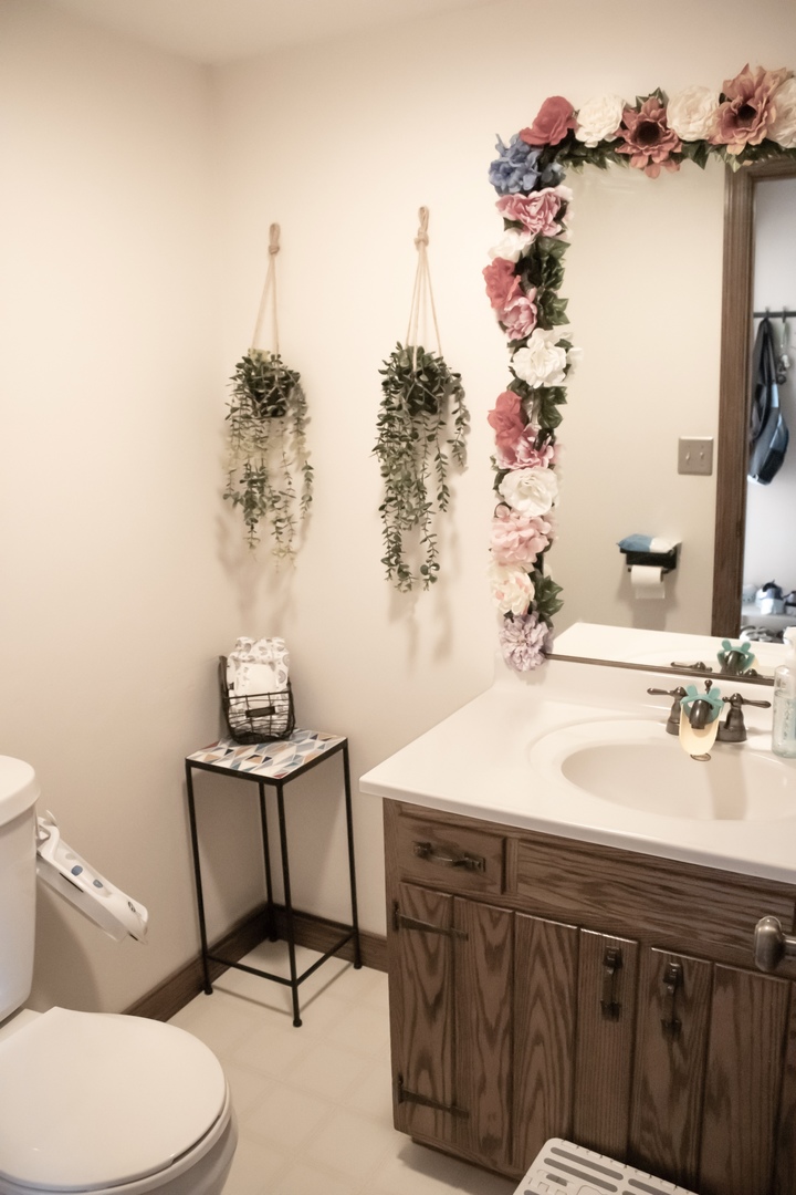 412 Spring Circle Urbana, IL 61802 - Photo 10 of 21 a bathroom with a sink vanity mirror and toilet