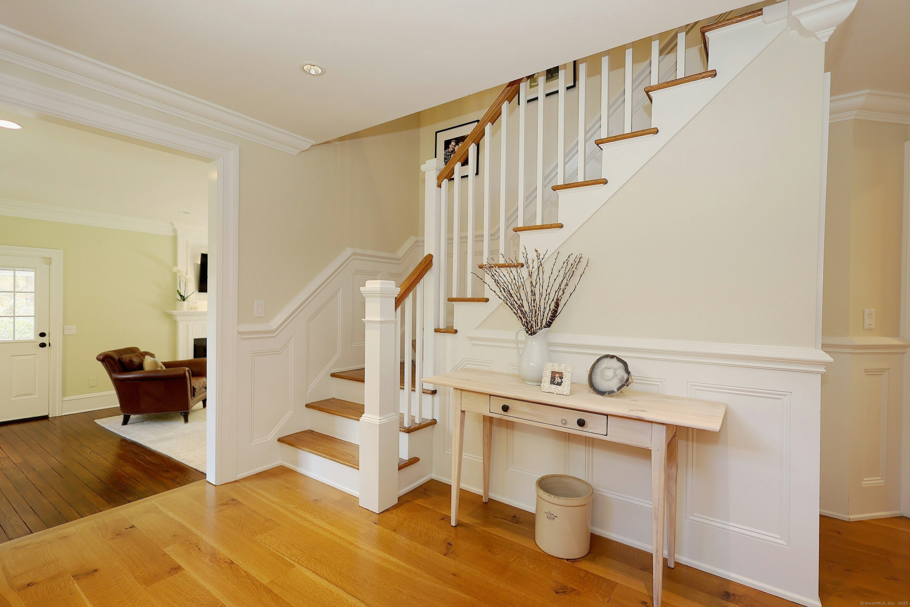 112 Middlebrook Farm Road Wilton, CT 06897 - Photo 12 of 40 a view of entryway kitchen and hall with wooden floor