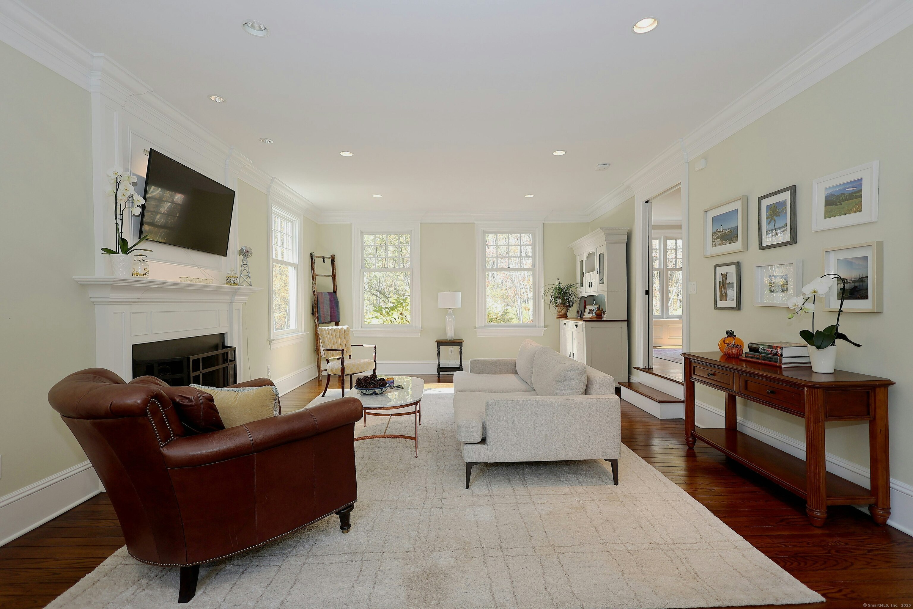 112 Middlebrook Farm Road Wilton, CT 06897 - Photo 14 of 40 a living room with furniture fireplace and flat screen tv