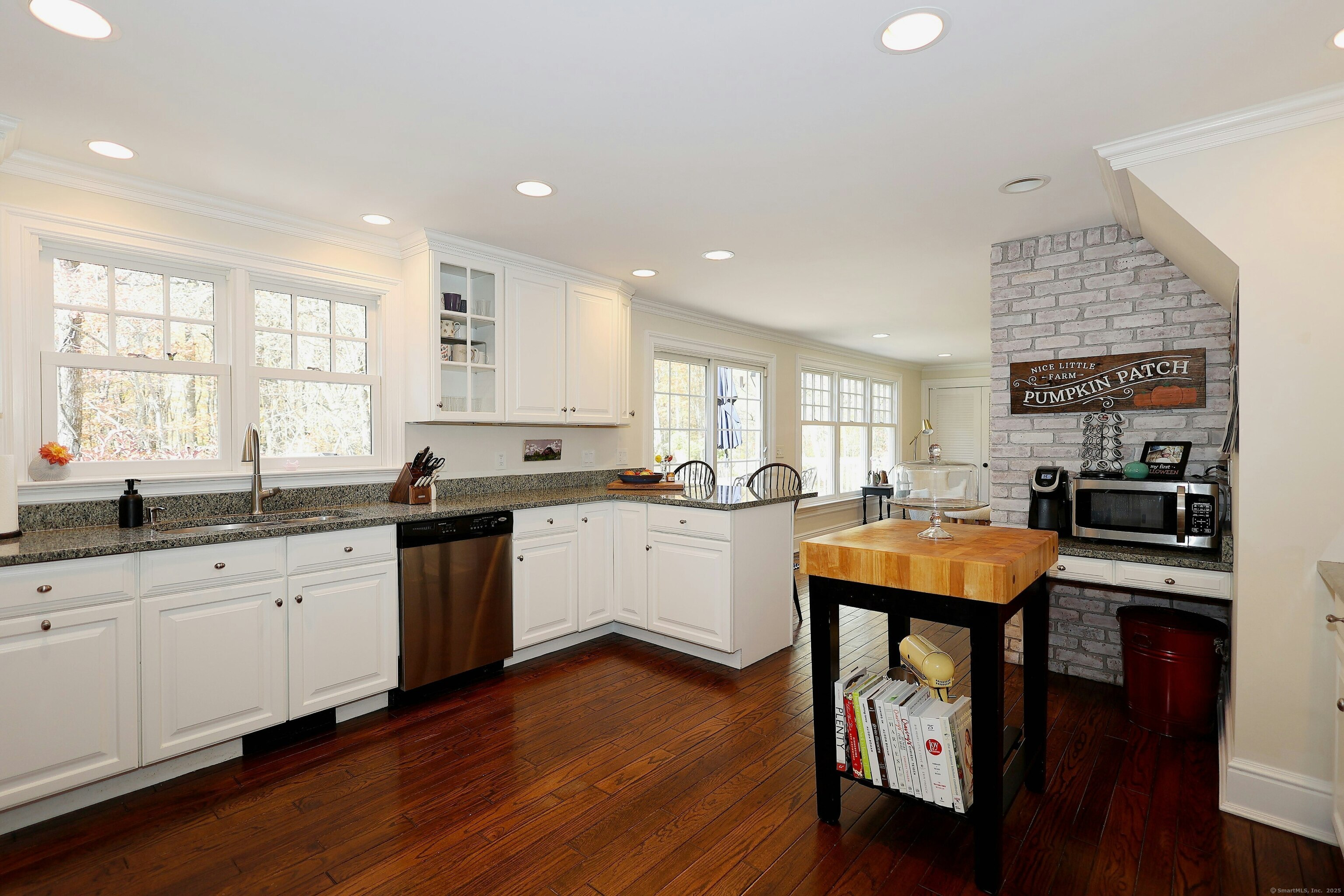112 Middlebrook Farm Road Wilton, CT 06897 - Photo 20 of 40 a kitchen with stainless steel appliances granite countertop wooden cabinets a sink and a stove