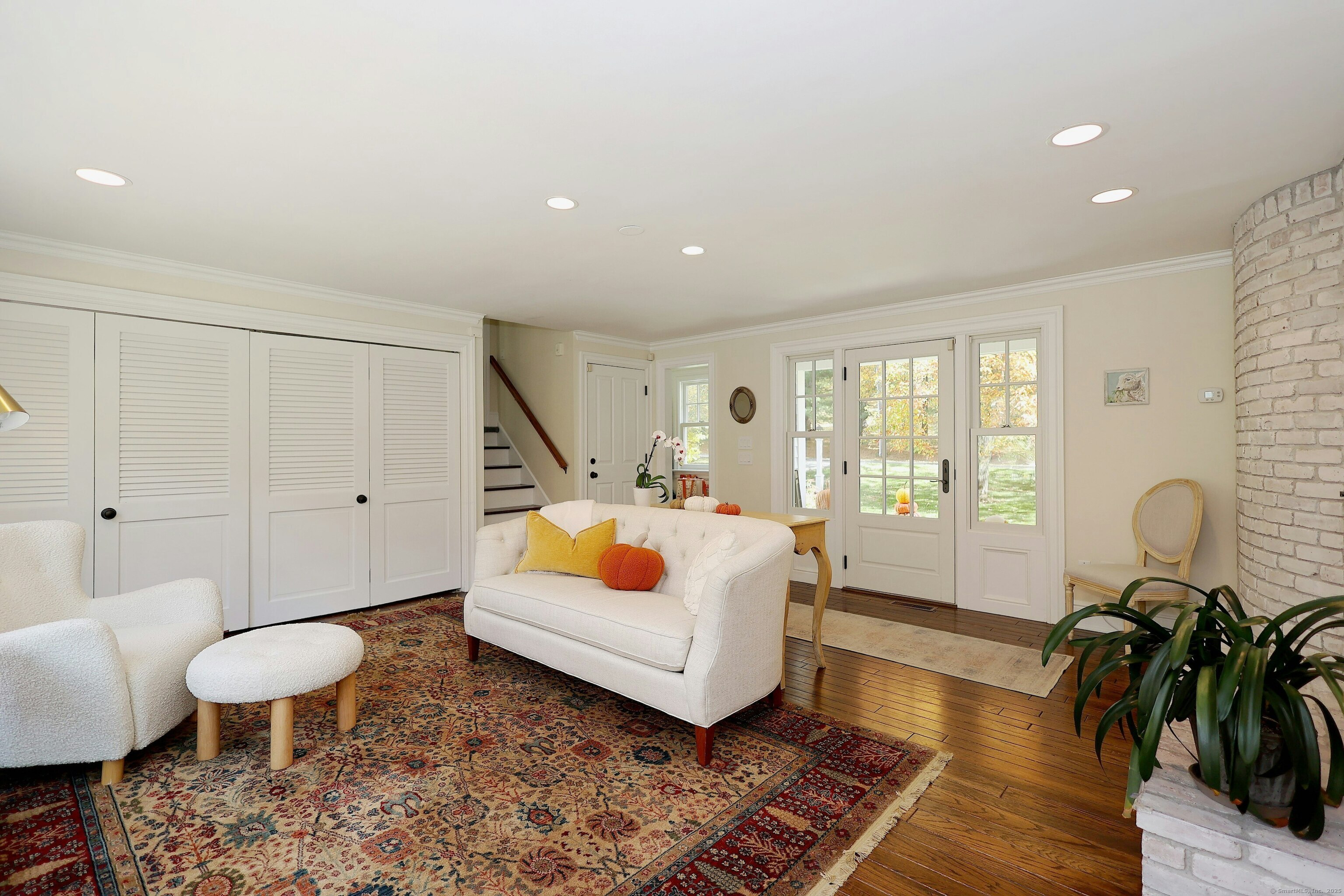 112 Middlebrook Farm Road Wilton, CT 06897 - Photo 22 of 40 a living room with furniture and wooden floor