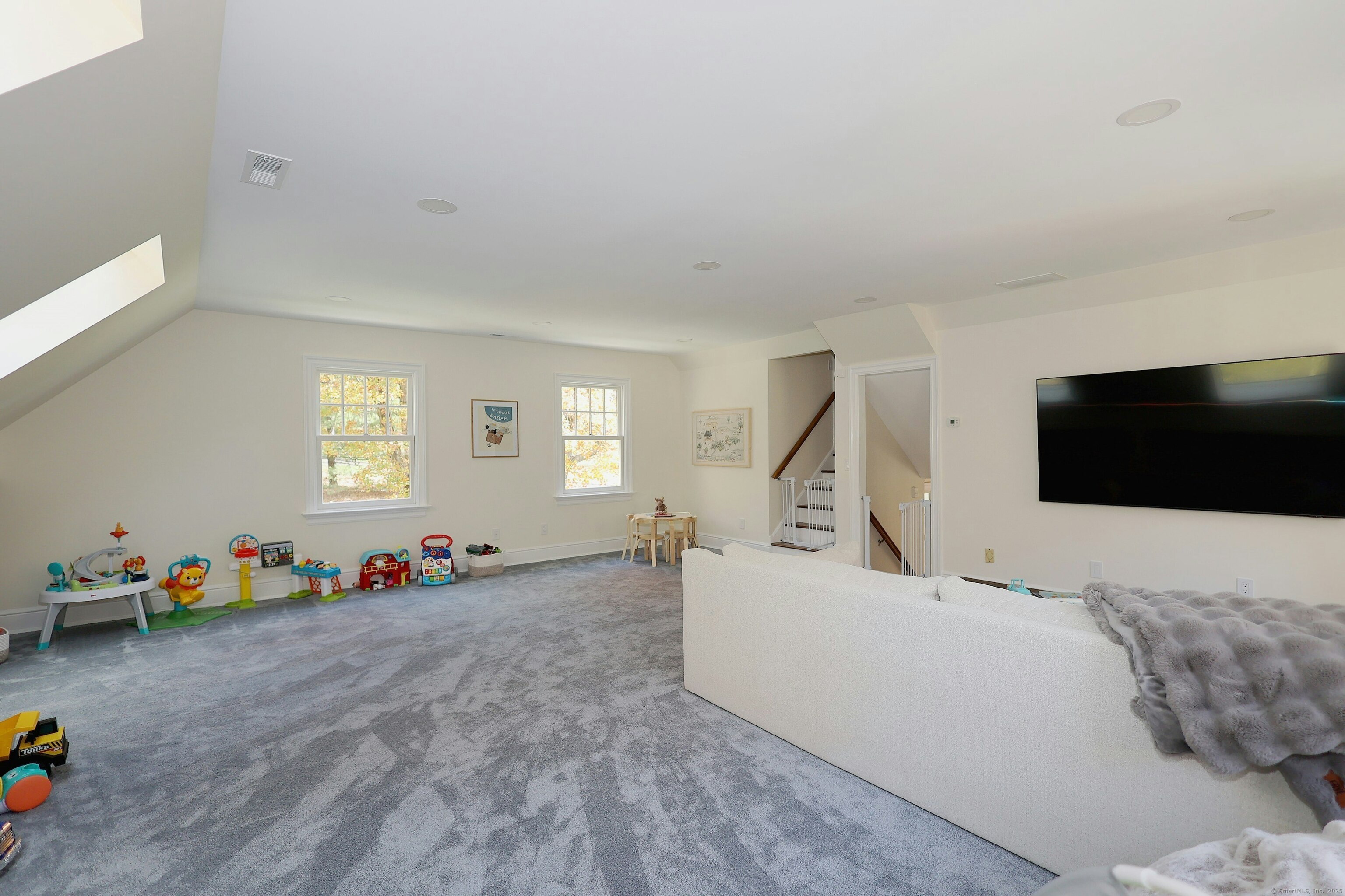 112 Middlebrook Farm Road Wilton, CT 06897 - Photo 25 of 40 a bedroom with furniture and a flat screen tv
