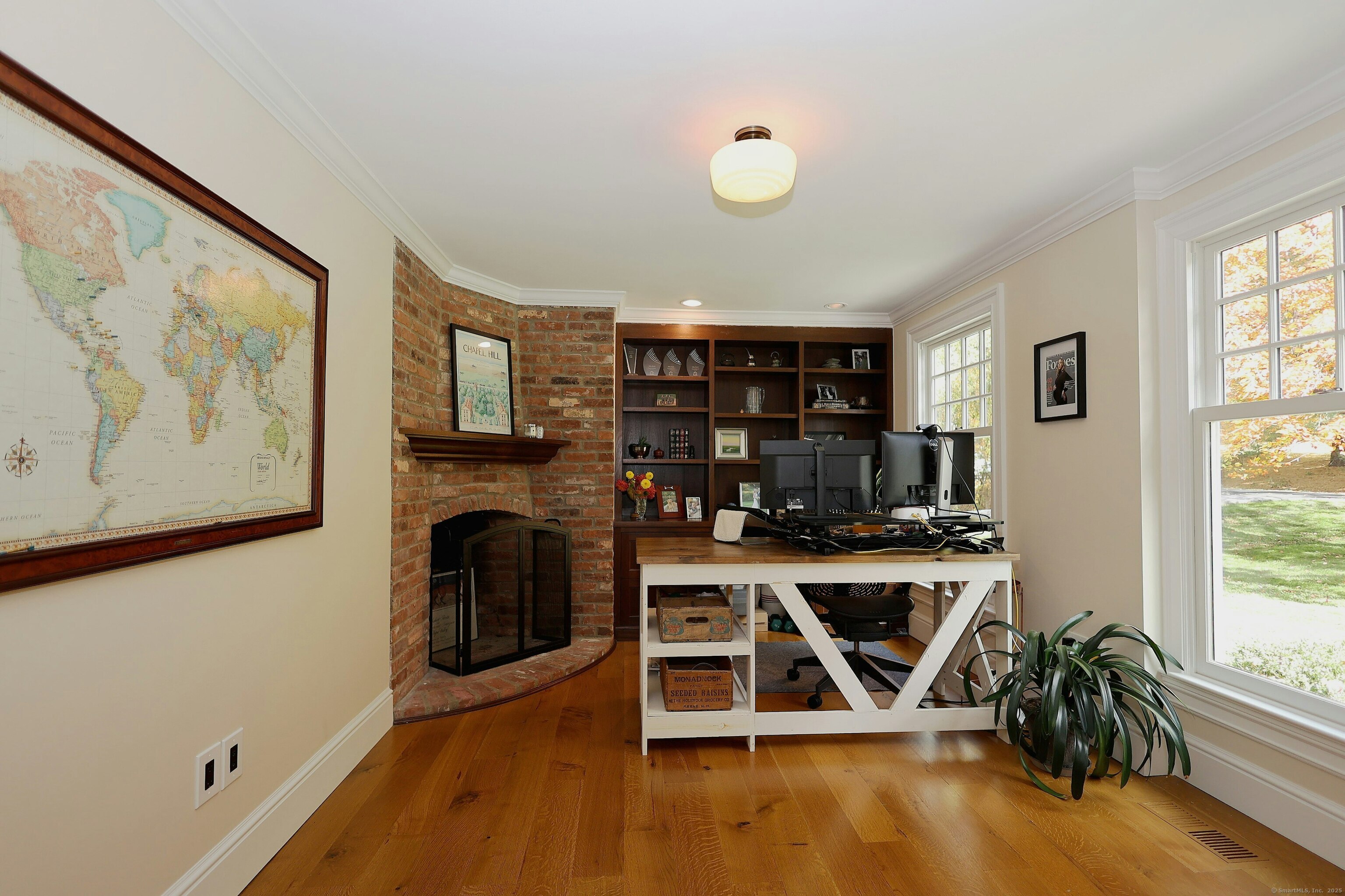 112 Middlebrook Farm Road Wilton, CT 06897 - Photo 26 of 40 a living room with wooden floor and floor to ceiling window