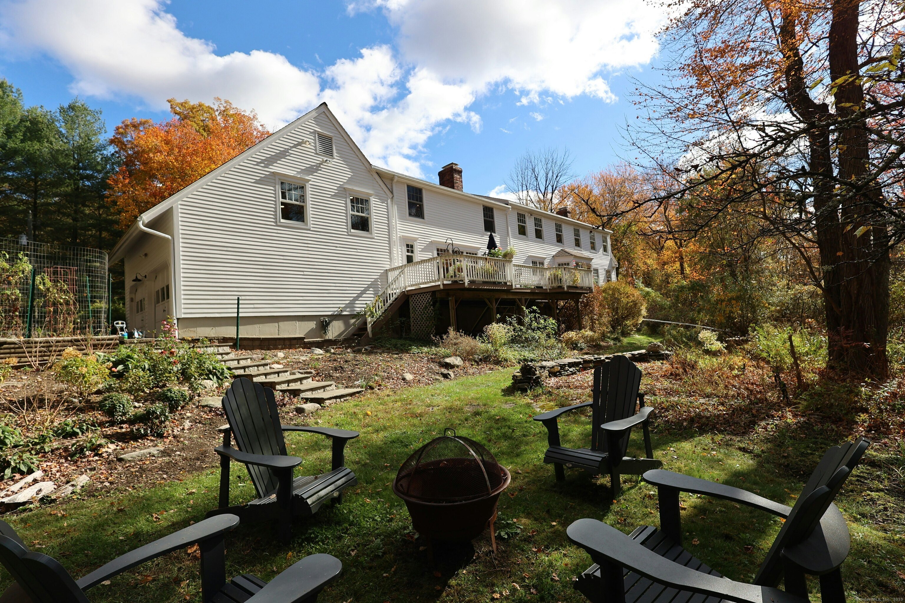 112 Middlebrook Farm Road Wilton, CT 06897 - Photo 3 of 40 a view of a house with backyard and sitting area