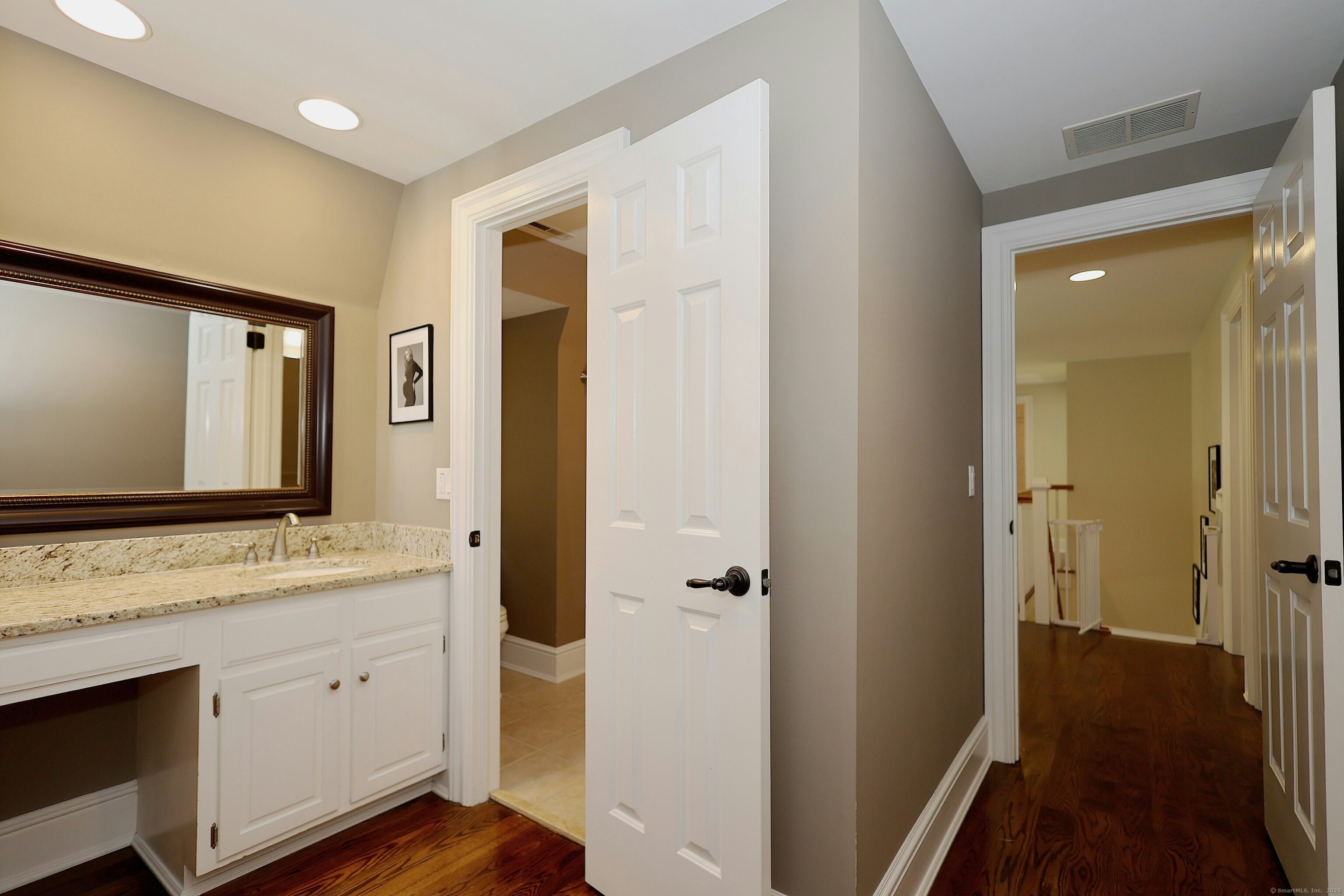 112 Middlebrook Farm Road Wilton, CT 06897 - Photo 33 of 40 a bathroom with a sink a mirror and a shower