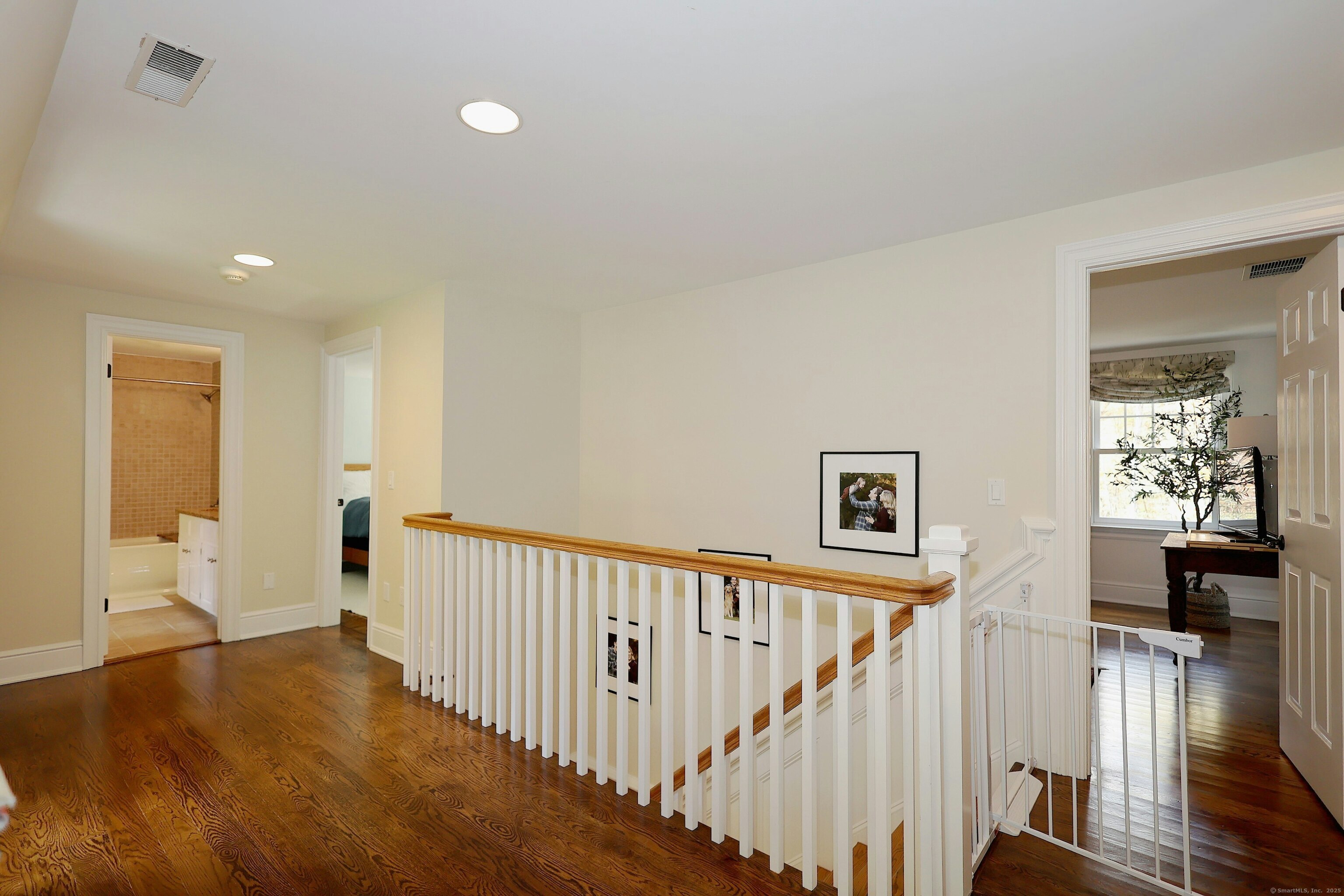 112 Middlebrook Farm Road Wilton, CT 06897 - Photo 38 of 40 a view of a hallway with wooden floor and dining room