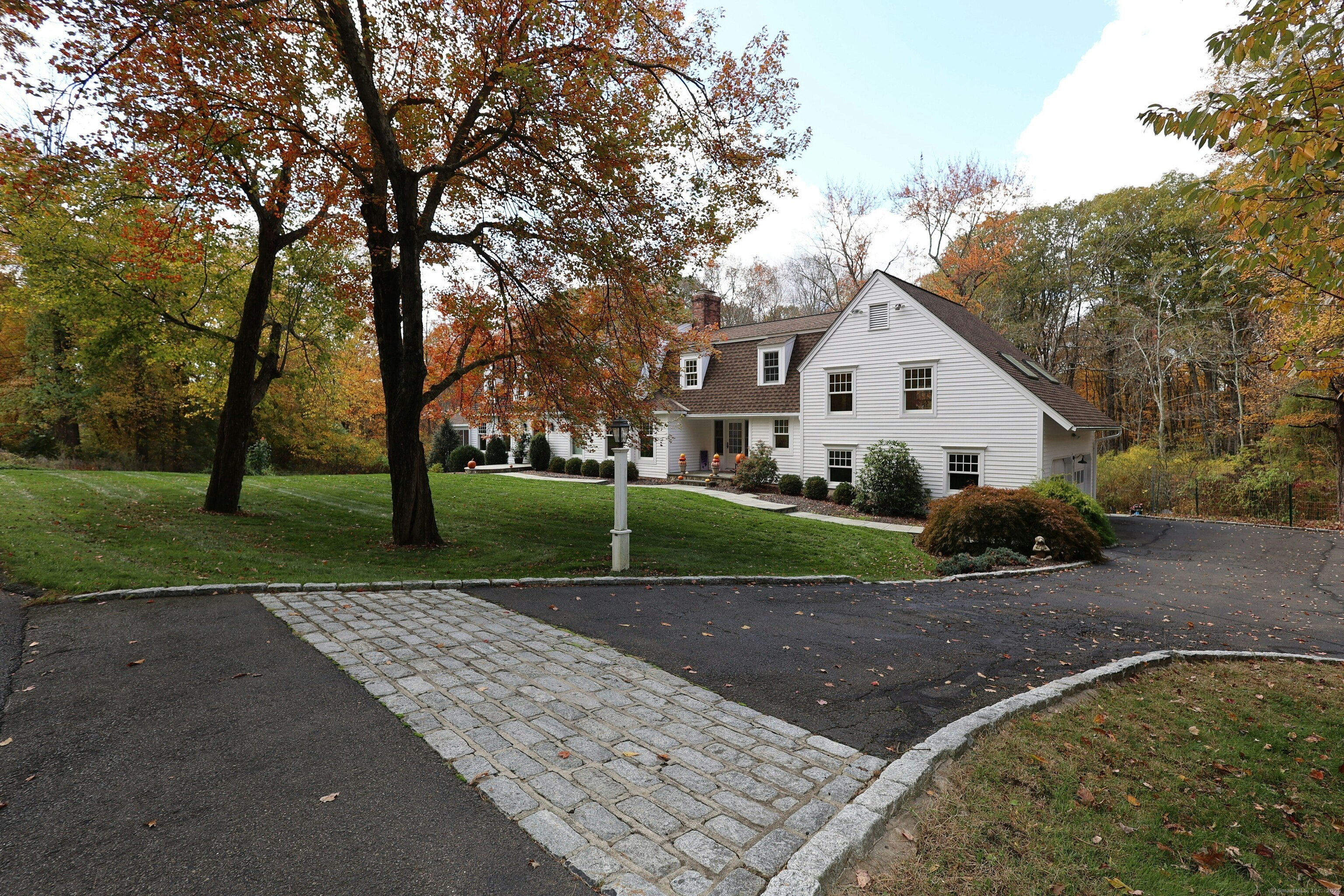 112 Middlebrook Farm Road Wilton, CT 06897 - Photo 40 of 40 a view of a house with a backyard