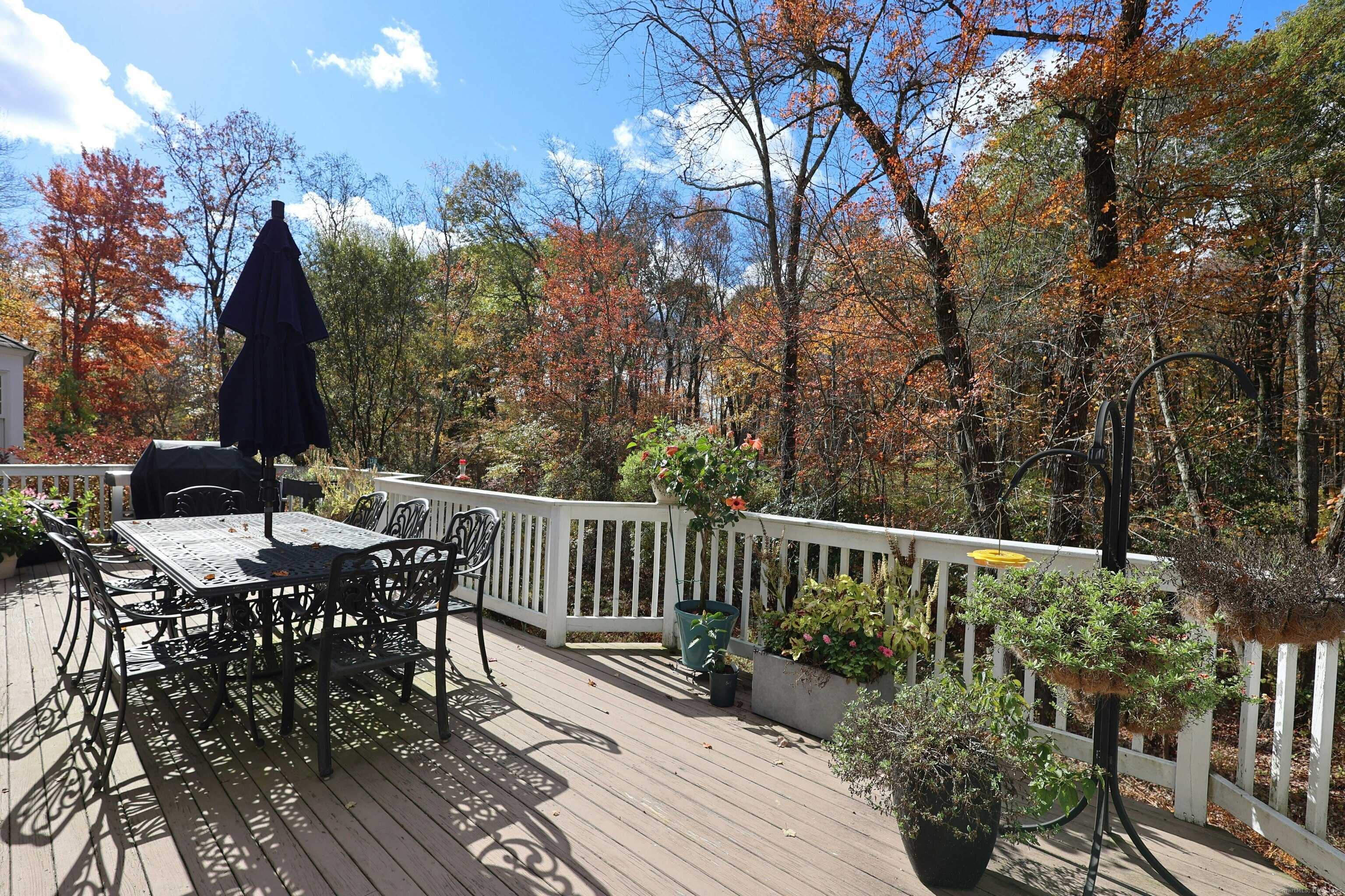 112 Middlebrook Farm Road Wilton, CT 06897 - Photo 4 of 40 a view of balcony with wooden floor and outdoor seating