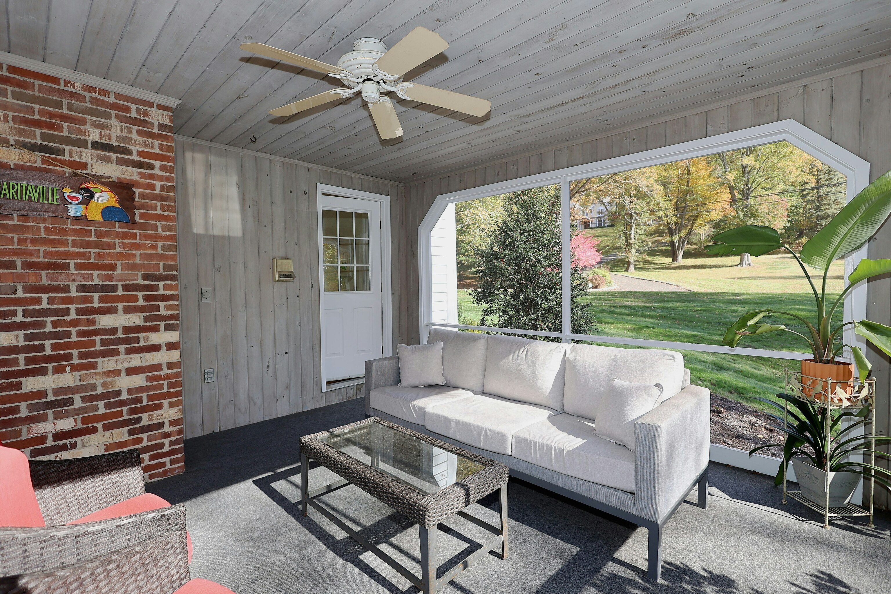 112 Middlebrook Farm Road Wilton, CT 06897 - Photo 5 of 40 a living room with furniture and a floor to ceiling window