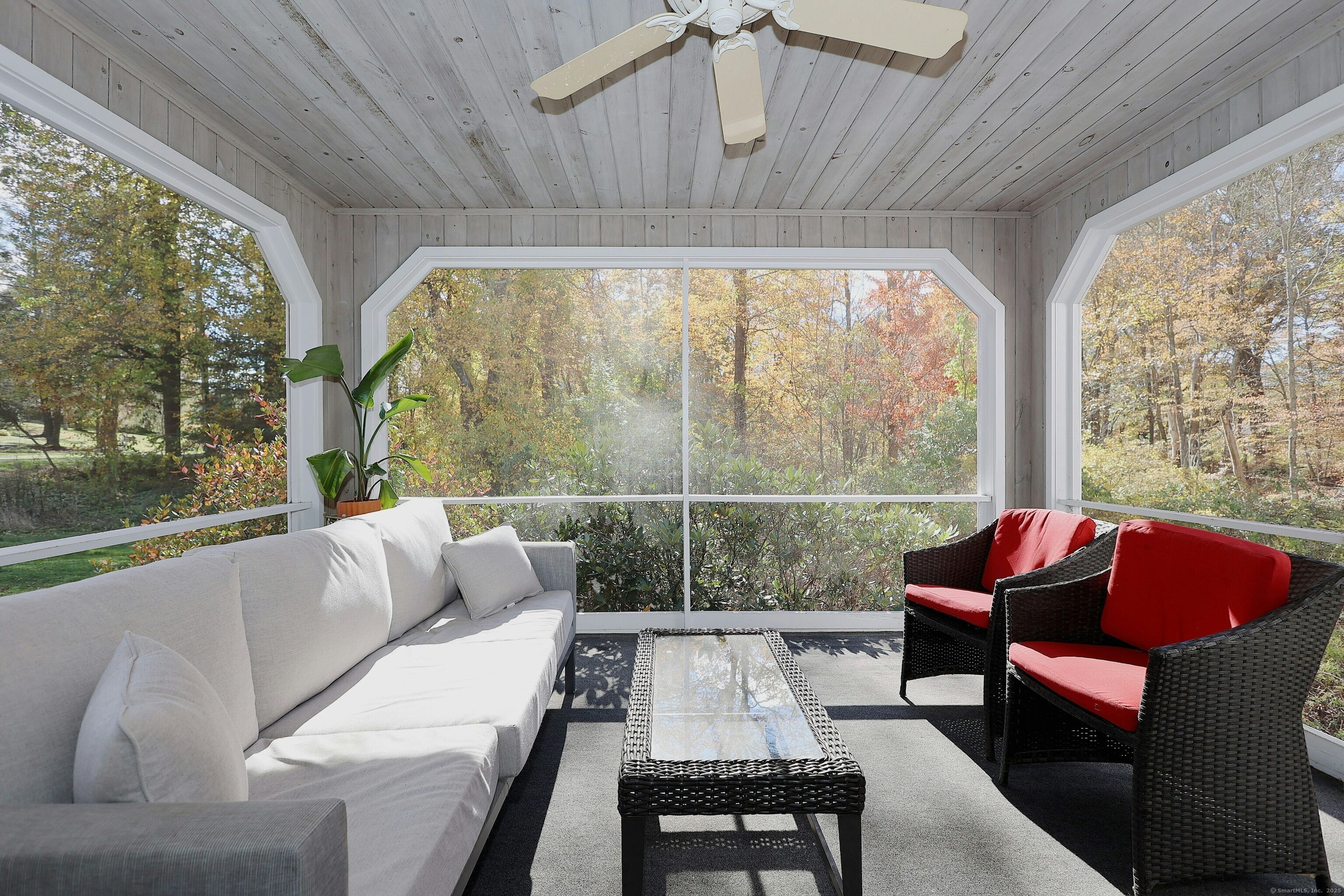 112 Middlebrook Farm Road Wilton, CT 06897 - Photo 6 of 40 a living room with furniture and a floor to ceiling window