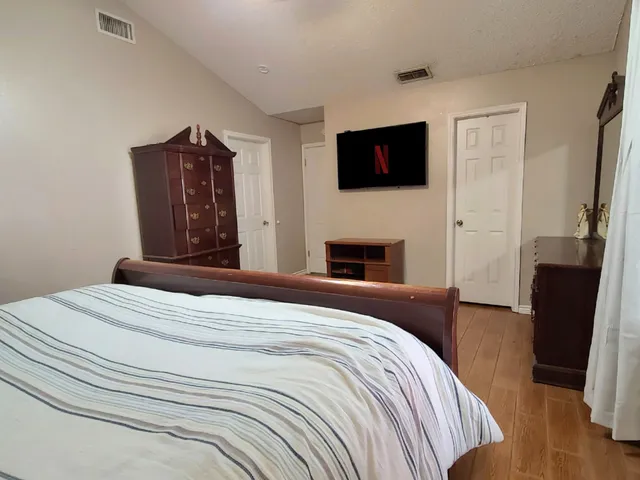 a bathroom with a shower and a sink