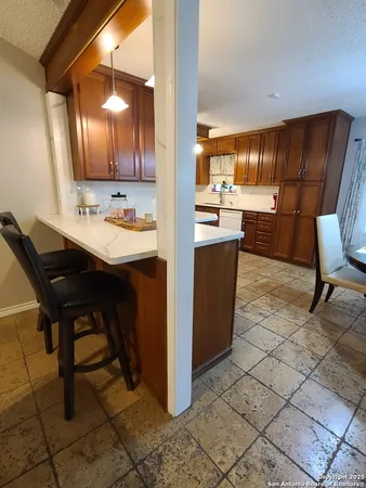 a view of kitchen with cabinets