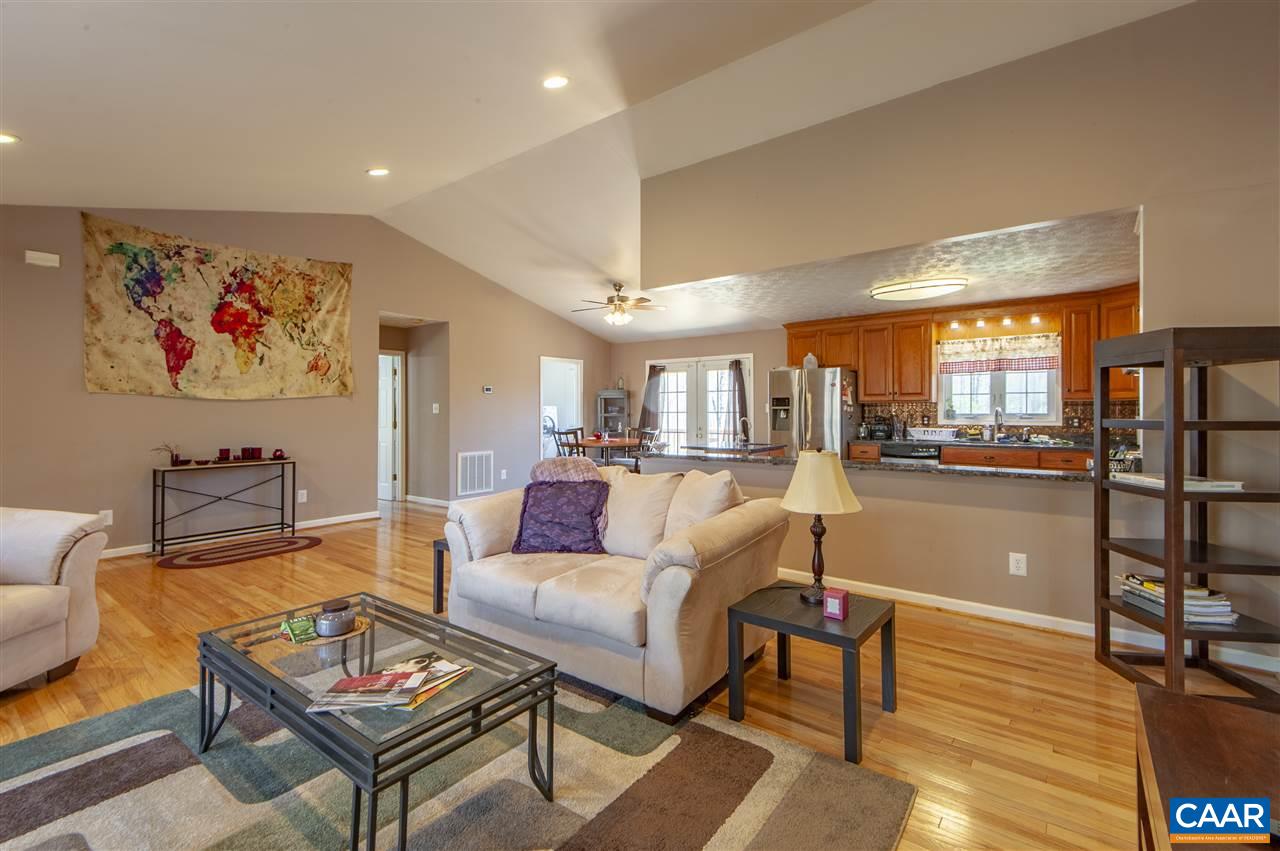 203 Quail Run Amherst, VA 24521 - Photo 12 of 45 a living room with furniture a rug and kitchen view