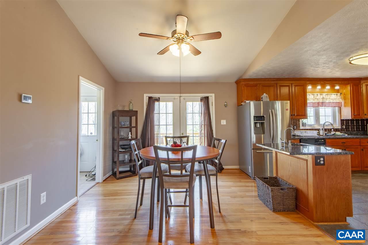 203 Quail Run Amherst, VA 24521 - Photo 13 of 45 a view of a dining room with furniture window and wooden floor