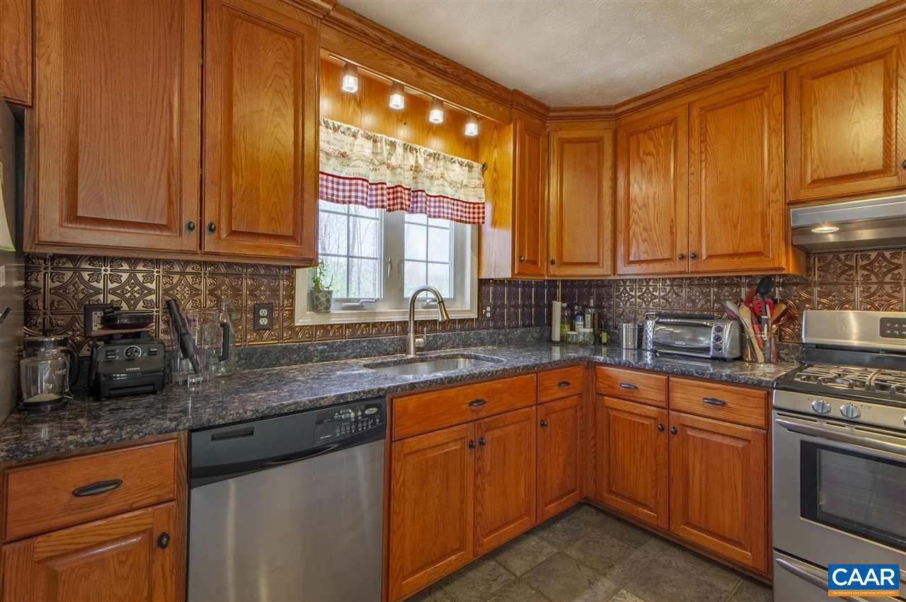 203 Quail Run Amherst, VA 24521 - Photo 17 of 45 a kitchen with stainless steel appliances granite countertop a sink stove and cabinets
