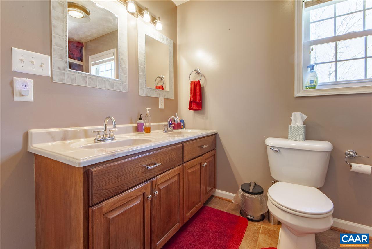 203 Quail Run Amherst, VA 24521 - Photo 22 of 45 a bathroom with a sink and a toilet