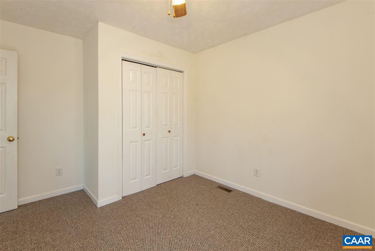 203 Quail Run Amherst, VA 24521 - Photo 24 of 45 an empty room with a ceiling fan and a window