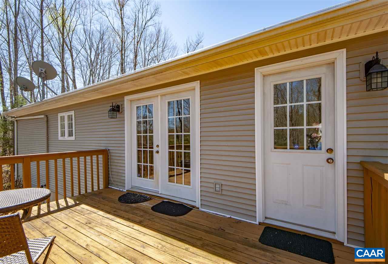 203 Quail Run Amherst, VA 24521 - Photo 29 of 45 a view of backyard with a balcony and wooden floor