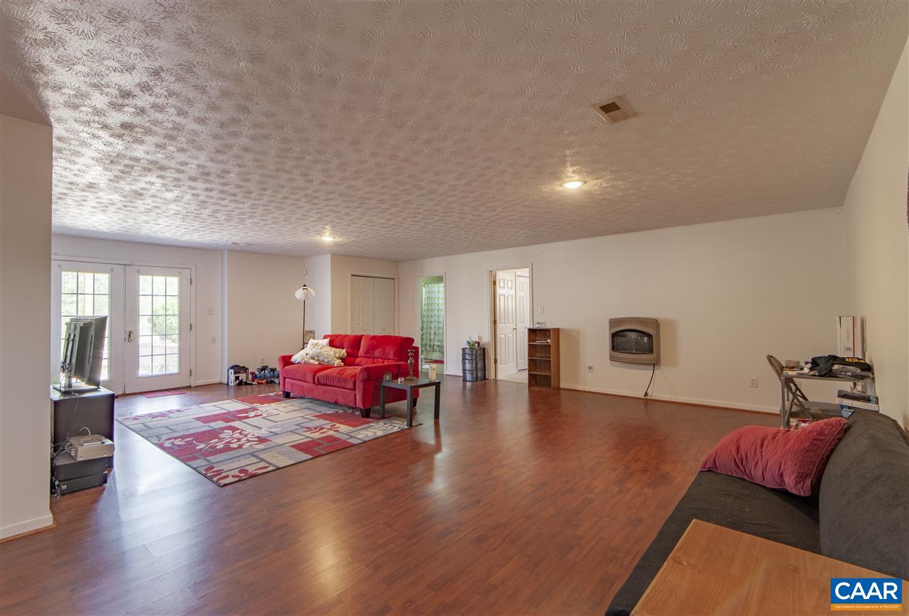 203 Quail Run Amherst, VA 24521 - Photo 31 of 45 a living room with furniture and wooden floor
