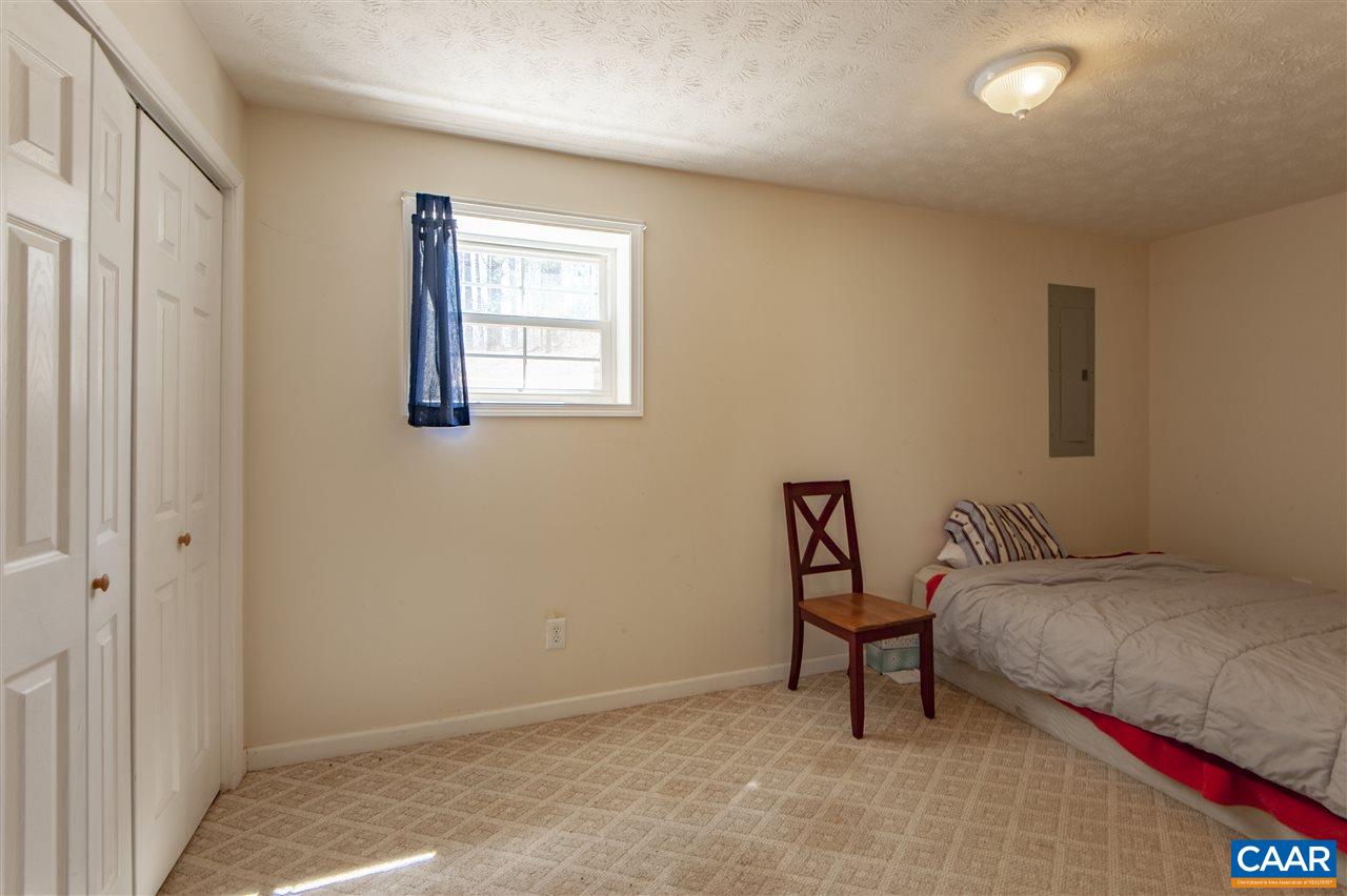203 Quail Run Amherst, VA 24521 - Photo 33 of 45 a bedroom with a bed and chair