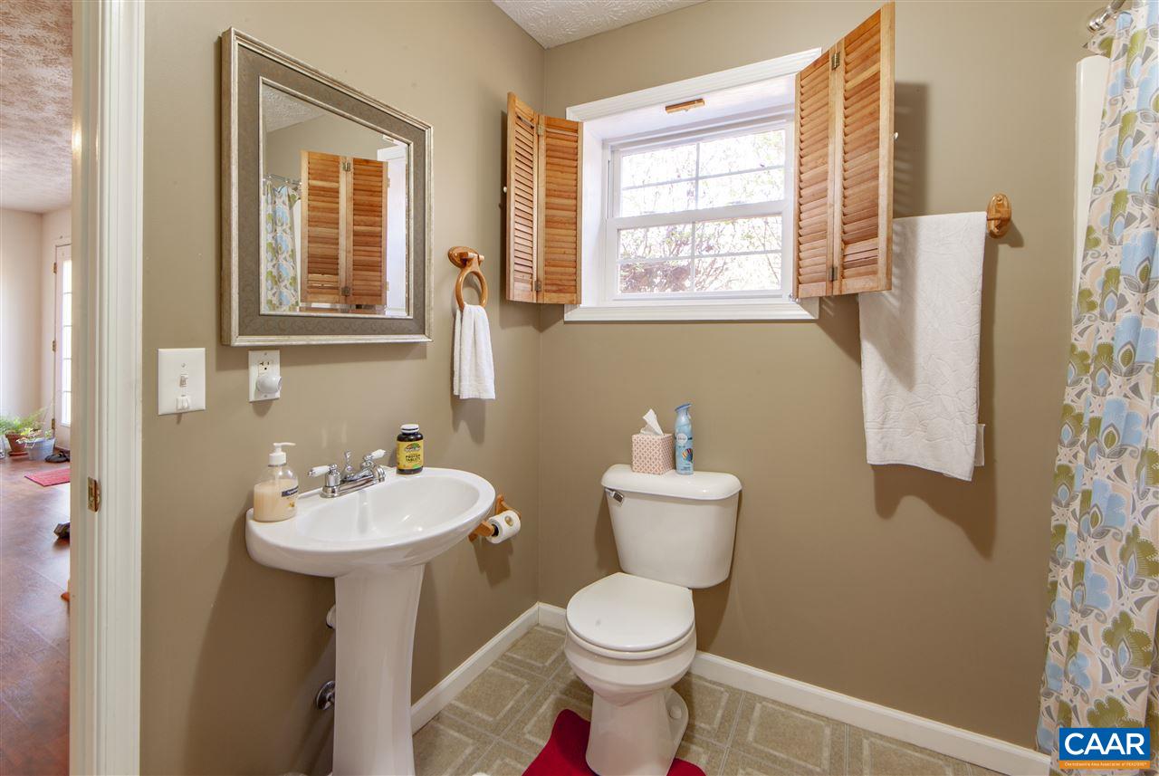 203 Quail Run Amherst, VA 24521 - Photo 34 of 45 a bathroom with a toilet sink and mirror