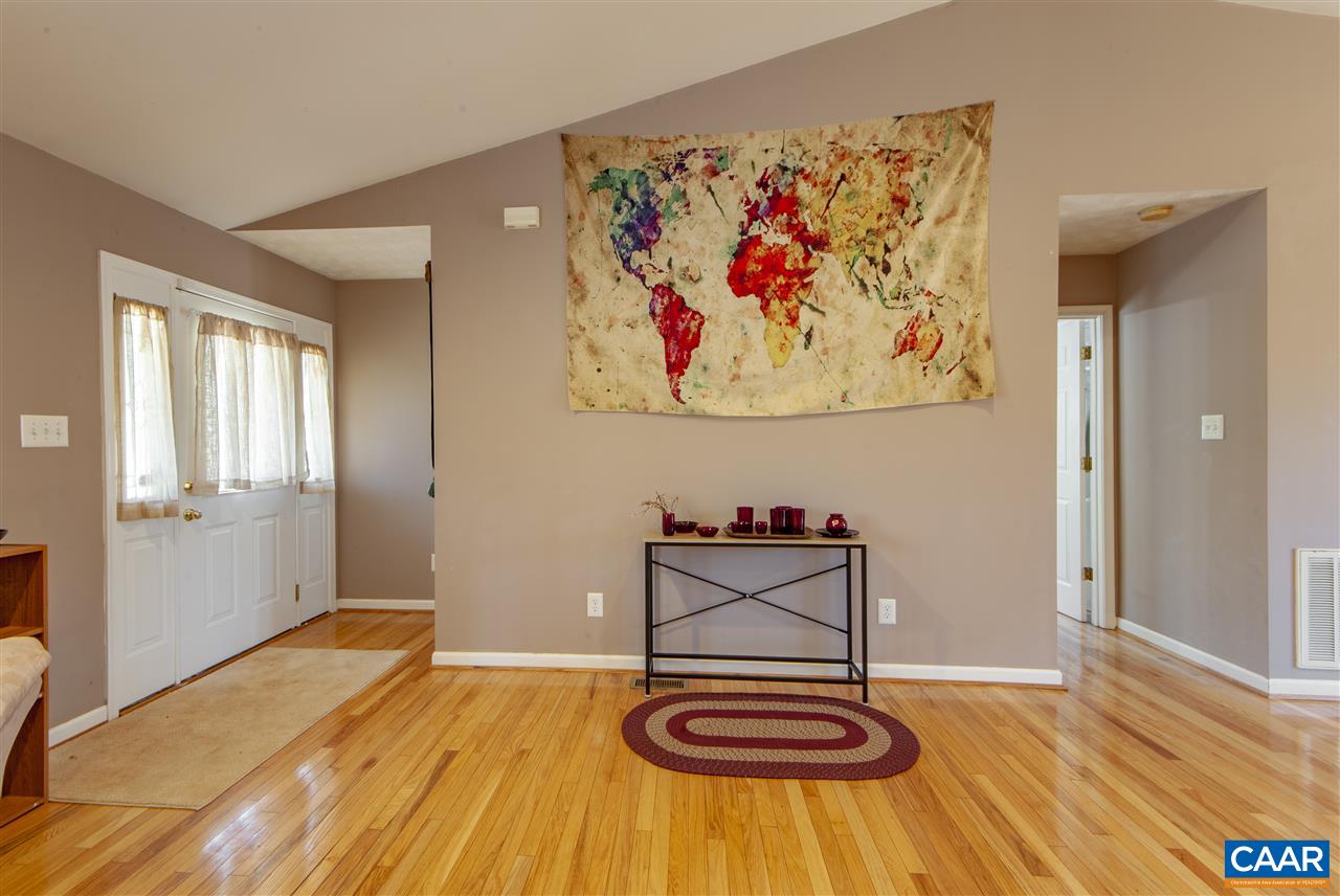 203 Quail Run Amherst, VA 24521 - Photo 8 of 45 a view of a livingroom with wooden floor and a window