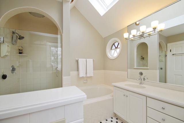 233 Ridge Avenue Winnetka, IL 60093 - Photo 13 of 25 a bathroom with a sink a toilet and a mirror