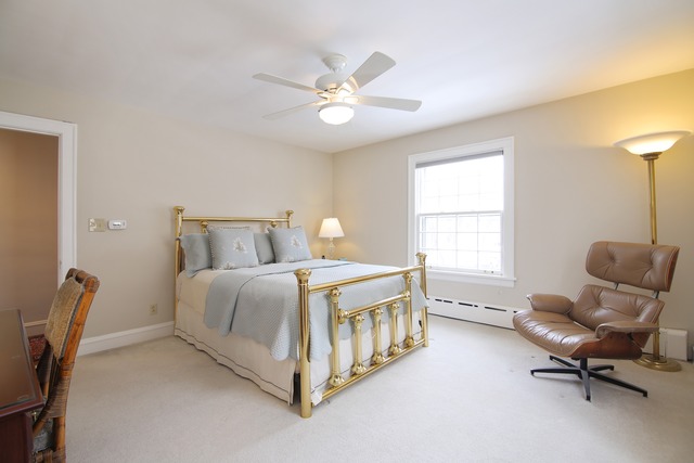 233 Ridge Avenue Winnetka, IL 60093 - Photo 15 of 25 a bedroom with a bed chair and windows