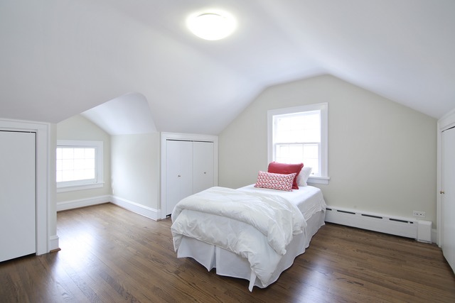 233 Ridge Avenue Winnetka, IL 60093 - Photo 18 of 25 a bedroom with a bed and wooden floor