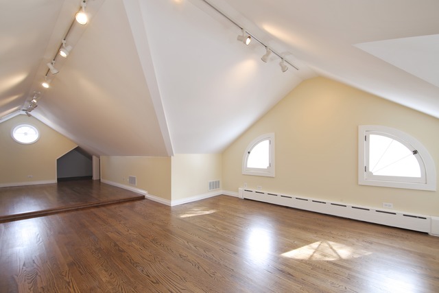 233 Ridge Avenue Winnetka, IL 60093 - Photo 19 of 25 an empty room with wooden floor and windows