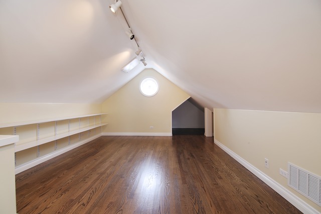 233 Ridge Avenue Winnetka, IL 60093 - Photo 20 of 25 wooden floor in an empty room with a window