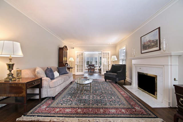 233 Ridge Avenue Winnetka, IL 60093 - Photo 4 of 25 a living room with furniture and a fireplace