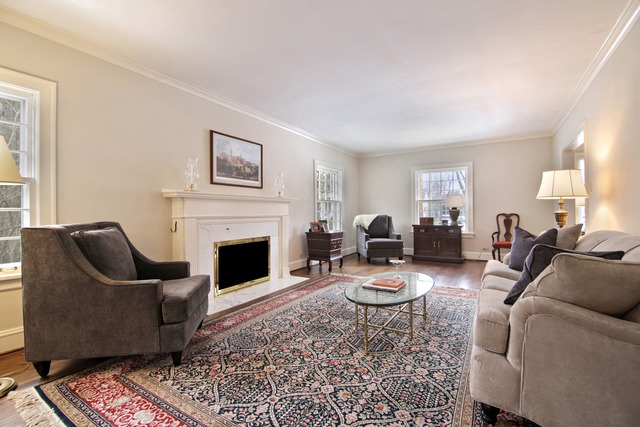 233 Ridge Avenue Winnetka, IL 60093 - Photo 5 of 25 a living room with furniture a fireplace and a window