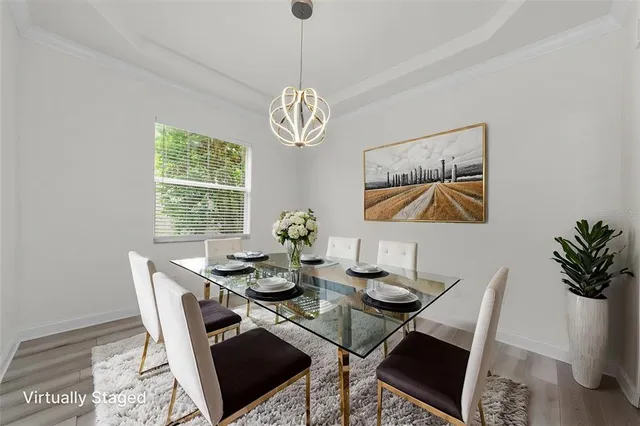 a view of a dining room with furniture and windows