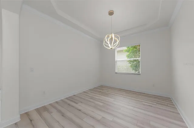 a view of a kitchen with cabinets stainless steel appliances