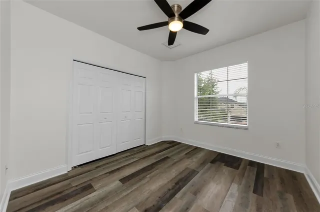 a view of room with wooden floor