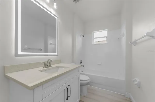 a view of a street with flower plants