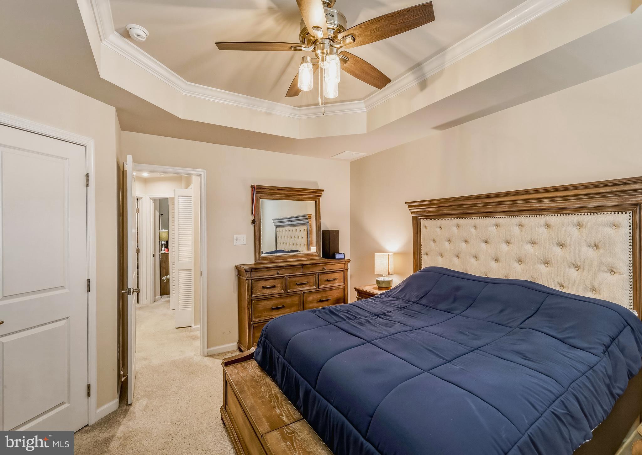36 Continental Boulevard Sicklerville, NJ 08081 - Photo 23 of 25 a bedroom with a bed and a chandelier