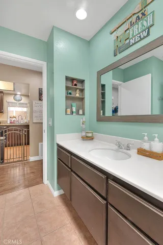 a bathroom with a sink and a mirror