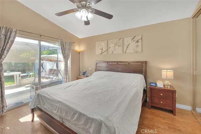 a spacious bedroom with a large bed and a large window