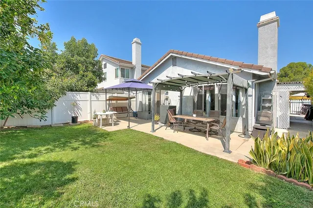 a view of a patio with swimming pool table and chairs