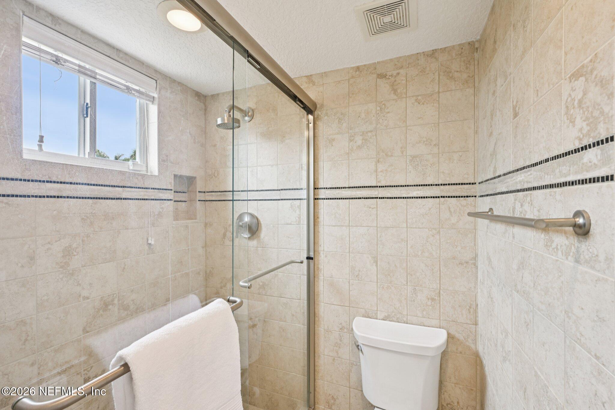 2802 2nd Street South Jacksonville Beach, FL 32250 - Photo 19 of 53 a bathroom with a toilet and a shower
